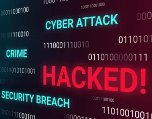 A Cybersecurity Alert: A computer screen displays the words: Cyber Attack and Hacked
